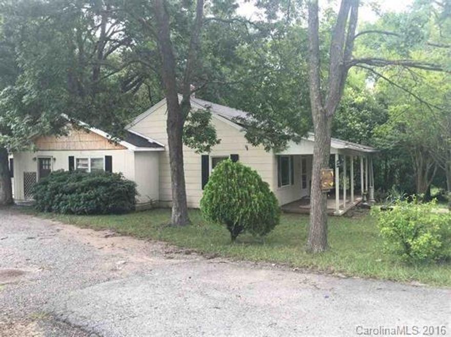 Investors Take A Look! 4 bedrooms, 2 full baths, 2 half baths, large kitchen, separate dinning area, detached 2 car garage, newer roof, and newer HVAC. Sold as is!