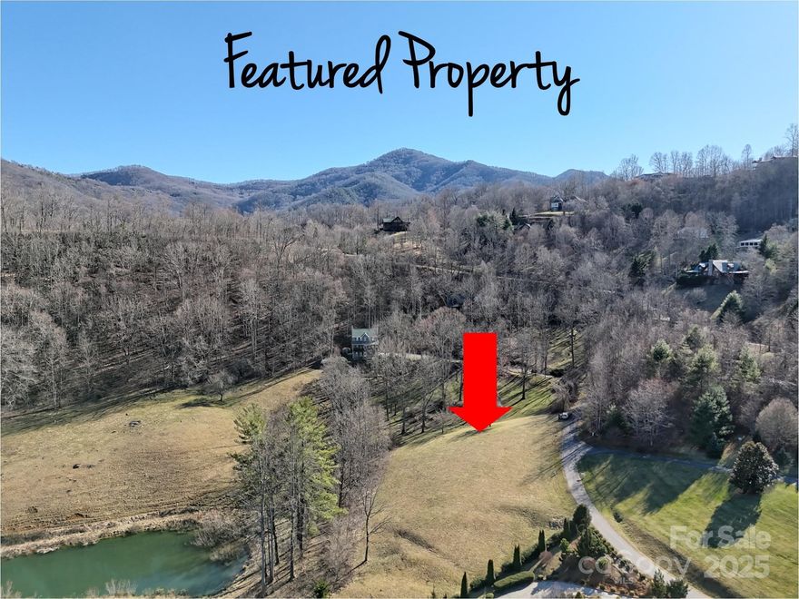Prime 1.55-acre lot in the desirable gated community of Campbell Mountain Estates, offering the perfect blend of convenience and year-round mountain views. This cleared, gently sloping lot minimizes grading work, making it an ideal choice for your dream home. Enjoy easy access on paved roads in an area of beautiful homes, plus the convenience of city water, underground utilities, streetlights, and Spectrum cable. A 5-bedroom septic improvement permit is already in place and is valid until 11/8/2027. Located just minutes from Historic Downtown Waynesville, Maggie Valley, Lake Junaluska, I-40, and 30 minutes from Asheville. Whether planning a full-time residence or a vacation retreat, amenities such as dining, shopping, healthcare, and outdoor recreation are nearby. Short-term rentals are permitted. Don’t miss the opportunity to build your mountain home on this exceptional lot. MOTIVATED SELLER