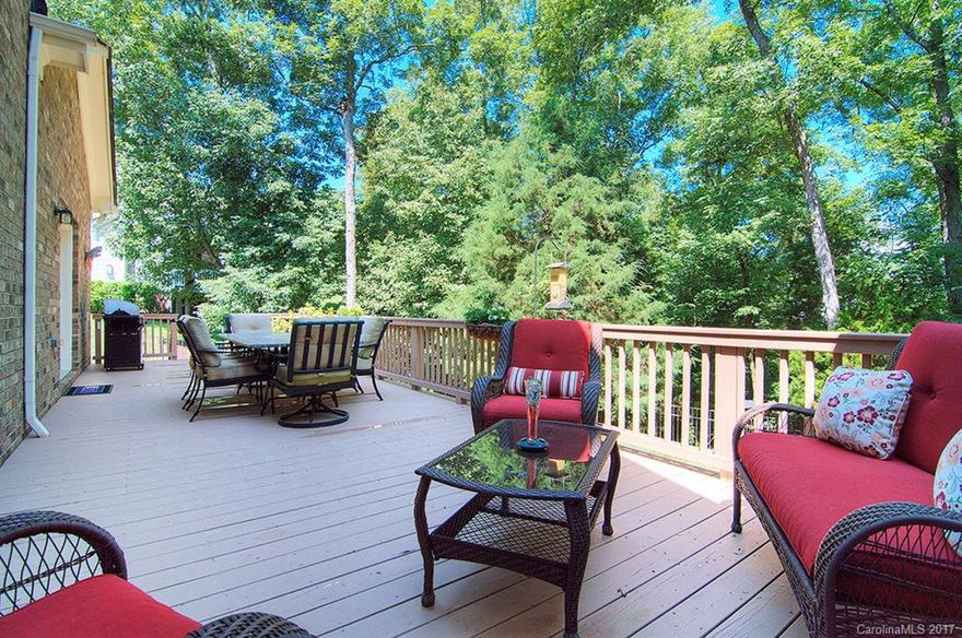 Spacious, flexible floor plan on the amenity rich Tega Cay Peninsula. Walk or bike to parks, playgrounds, lake beaches, walking trails, and Tega Cay's own 27 hole golf course. Gorgeous two story Great Room with beautiful views of the wooded lot. Large gourmet kitchen with stainless appliances, double oven, island, and breakfast bar. Master on main with deck access to private back yard. Large bedrooms and huge bonus room over 3 car garage. New upstairs AC. Fort Mill Schools, Tega Cay Lifestyle!