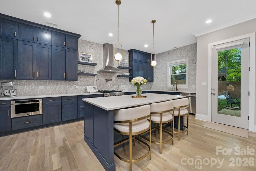 3505 Oakwood Avenue presents a rare opportunity to own a highly upgraded, move-in ready residence in one of Charlotte’s most dynamic neighborhoods. Built in 2023 and thoughtfully enhanced beyond its original construction, this home offers a level of finish and convenience that typically commands a significantly higher price point in other areas of the city.

The main level is designed for both functionality and comfort, with expansive living spaces that connect naturally and create an ideal setting for everyday living and entertaining. The kitchen stands out with a large quartz island, premium JennAir appliances, and upgraded cabinetry, delivering a refined yet practical centerpiece for the home. Natural light fills the interior, complemented by motorized window treatments that provide both ambiance and privacy.

Upstairs, the layout offers flexibility to meet a variety of needs, including additional bedrooms and a versatile space suitable for a home office, media room, or fitness area. The primary suite is designed as a private retreat, featuring a spa-inspired bath and an enhanced custom closet system that maximizes storage and organization.

What truly distinguishes this property is the extensive investment made after purchase—allowing the next owner to avoid the time and expense typically required to elevate a newer home. Improvements include a whole-house water filtration system (with warranty), integrated security system with glass break and entry sensors, smart lighting throughout the main level, motorized blackout shades in the primary suite, and remote-controlled shades across the main living areas. The garage has been upgraded with epoxy flooring, built-in storage, and a universal EV charging solution.

Select high-value items will convey, including the JennAir appliance package, LG washer & dryer with pedestal washer, and LG steamer system, installed safe, Tonal home gym system with accessories, and mounted televisions in the main living area and gym space. (Certain personal items and additional equipment are excluded.)

Positioned just minutes from NoDa’s restaurants, breweries, and local hotspots, with convenient access to Uptown and major thoroughfares, this home offers a compelling combination of location, upgrades, and overall value.

For buyers seeking a residence that stands apart from standard new construction, 3505 Oakwood Avenue delivers a rare blend of quality, convenience, and long-term livability.