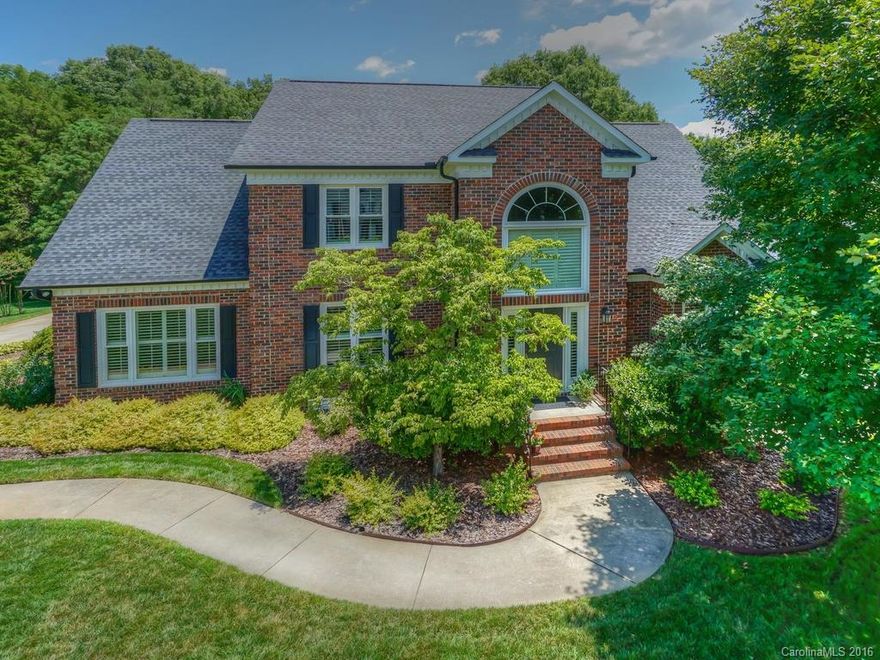 Stunning 2 story in prestigious Asheford Green. Gleaming hardwood flooring throughout kitchen and formal areas.  Master suite on main level with luxurious bath featuring jaccuzzi tub and step in shower, double vanities, 2 walk in closets and french doors leading to back deck.  Spacious bedroom up with jack and jill bath, a bonus room and walk in attic storage that could possibly be finished as another bonus room. Salt water pool, irrigation system in front and back yards. Immaculate landscaping!