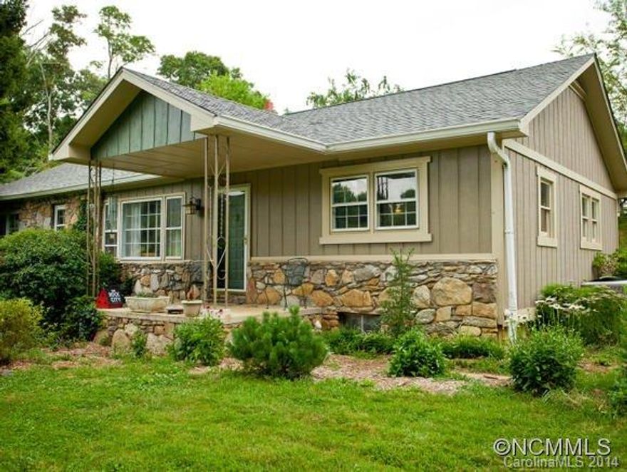 Reduced below recent appraisal!!  Charming stone clad cottage with a surprisingly modern, open floor plan on a large lot with pastoral views. There is room to grow in this home with a FULL basement that can be readily converted to living space. Roof and HVAC replaced in 2007. Hardwood floors throughout. A few updates and this is a dream house. Room for gardening as well, for an urban homestead.