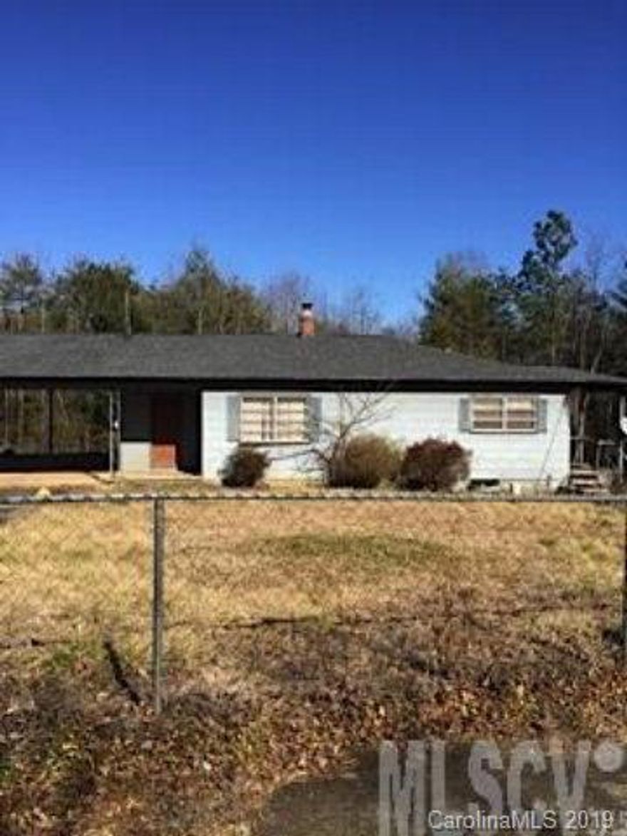 Home located in Glen Alpine but convenient to Morganton and Lake James. Home needs some interior updating and repairs. Will not qualify for any type of loan. Large acreage tract and detached storage building. Carport and full basement make for lots of potential in this one.