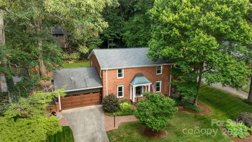 Step into this charming southern sanctuary nestled in highly sought-after Shiland Hills. Hardwood floors guide you through elegant living spaces: a formal dining room, a separate office, and a cozy keeping room off the chef's kitchen with breakfast nook. Four bedrooms, including a darling master suite, offer comfort and tranquility upstairs. Outside, the fenced-in backyard features a stunning brick patio, fire pit area and serene outdoor fountain. The oversized garage accommodates two cars plus storage and space for a golf cart. Perfect for entertaining or relaxing, this home combines southern charm with modern convenience in a prime location. Home features gas log fireplace, gas stove top, custom Kitchen-Aid mixer lift in cabinet, built-ins with lighting in dining room, front and back yard irrigation, newly refinished hardwood floors, granite countertops, newer windows and kitchen appliances, and access to neighborhood pool (dues paid separately!). A must-see in person!!