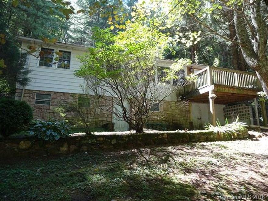 Property in Balsam, NC lot is very nice with water and septic. Home is in unsafe condition to enter and may or may not be salvageable depending on what a buyer wants to do.