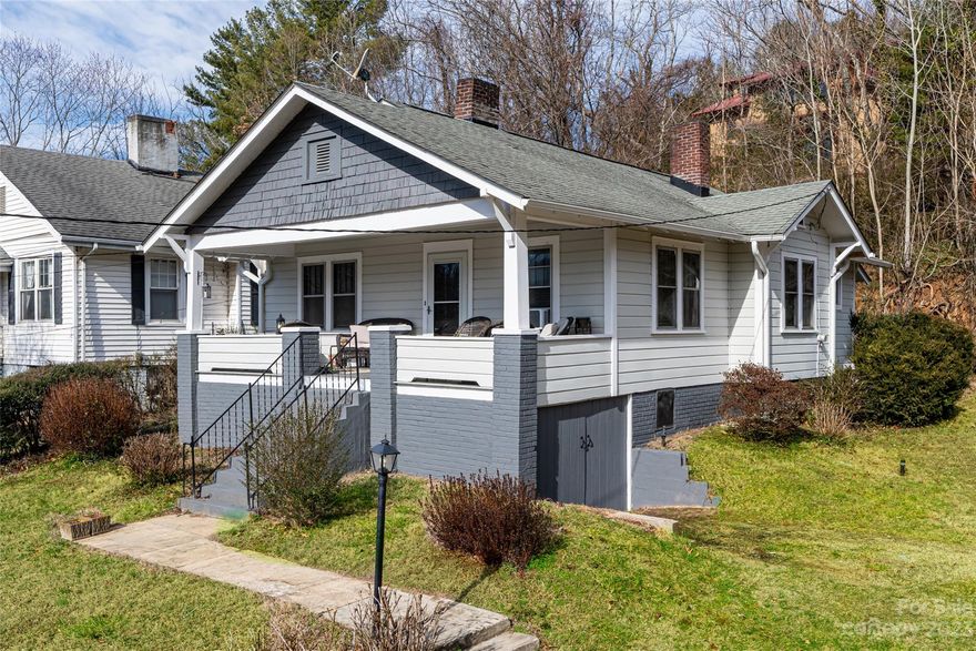 A rare find in Asheville's Five Points neighborhood! Move-in ready home sitting on .53 acres full of historic charm. A covered front porch for gatherings, relaxing and taking in the views. Large double lot for expansive play, gardening or pets. Original hardwood floors throughou (under carpet in living and dining room), updated kitchen and a third bonus room without a closet. Open floor plan with tons of natural light. Formal dining room and an eat-in kitchen area. Amazing location across from the Reed Creek Greenway and walking distance to Trader Joe's, Harris Teeter and Asheville's vibrant downtown. From the back yard or located off of Dortch Avenue there are wooded walking trails that lead to the Asheville Botanical Gardens. Please see GIS map to understand the depth and expansiveness of this property. This property is a hidden gem, don't miss it!