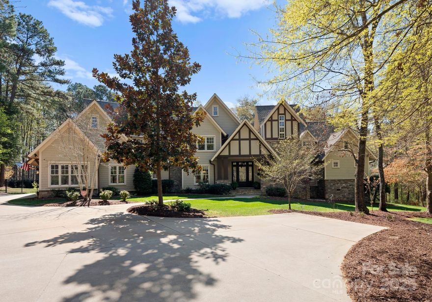 Nestled on 4.8 serene acres in The Sanctuary at Lake Wylie, this cedar shake & stone estate offers perfect blend of luxury & privacy w/over 5,500 SF of living space featuring primary suite on main level, 3-car garage, & stunning architectural details

The beautifully appointed kitchen flows into family & dining areas & is complemented by large butler's pantry for abundant storage & entertaining. Indoor & outdoor masonry fireplaces w/gas log inserts, outdoor surround sound speakers. Expansive windows frame views of the private backyard oasis, complete with a tranquil brook & koi pond. The paver patio & covered porch are perfect for morning coffee or evening relaxation

Recent upgrades include: remodeled kitchen & appliances, Hickory HW flooring in bonus room & gym, new carpeting in 3 upstairs bedrooms, 2 new HVAC units, 2 new water heaters, new roof & copper gutters. Designer lighting enhances every room, 2 large attics & encapsulated crawlspace provide abundant storage