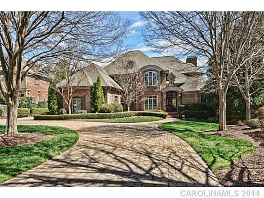 Nationally acclaimed Simonini custom home on 16th fairway of Ballantyne Country Club. Enjoy living here with Brazilian Cherry floors, detailed cabinetry, inviting rooms with architectural ceilings and open double doorways to outdoor living.   Wine, media, exercise, bar and billiard/game room plus a bedroom suite on the lower level. Golf course and water views from the living & entertainment areas. Relax or entertain in the screened porch or covered patio while enjoying a dip in the pool or spa.