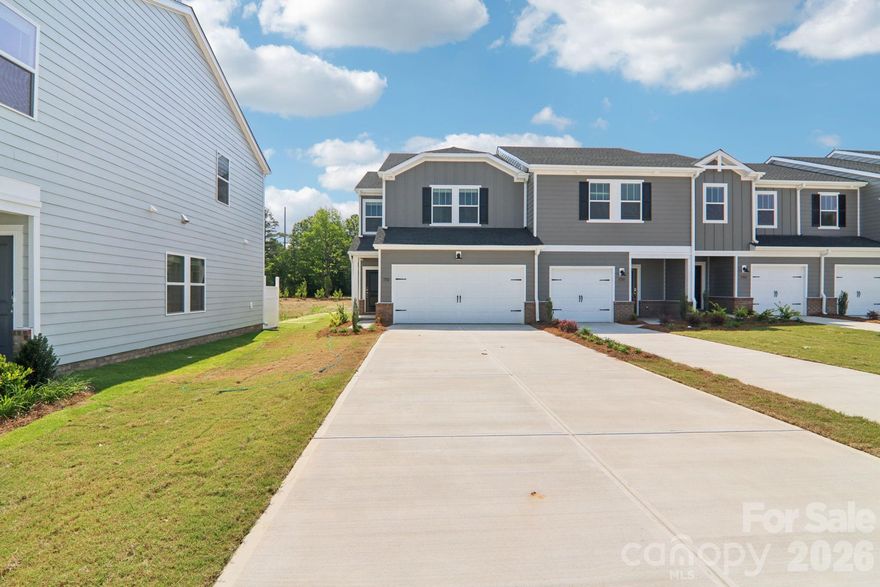 Brand new, energy-efficient home available by May 2026! Sip your coffee perched at the kitchen island. The household chef will appreciate ample counter space and the oversized pantry. Upstairs, the relaxing primary suite features a private ensuite and walk-in closet. New move-in ready townhomes in Northwest Charlotte from the $300s check every box: energy-efficient and smart-home features, equipped with a washer, dryer, fridge and whole-home blinds. Guaranteed to close in 60 days or less. Enjoy a low-maintenance lifestyle, a private resort-style pool and relaxing days in your private primary suite, all with easy access to Uptown Charlotte and Lake Norman.  Each of our homes is built with innovative, energy-efficient features designed to help you enjoy more savings, better health, real comfort and peace of mind.