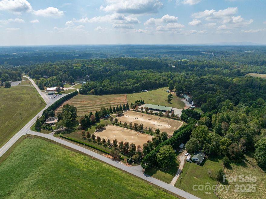 Clear View Farm | Landrum, SC / Tryon, NC Area

Set on 21.48 acres in the heart of horse country, Clear View Farm is a premier equestrian facility designed for top-level operations. The farm combines extensive infrastructure with a strong business foundation—offering the rare chance to step into a producing, well-recognized program.

The main barn features 13 stalls, three wash stalls, a feed room, shavings storage, office, and tack room. Just outside, two irrigated arenas measuring 125' x 250' and 300' x 150', along with a 90' round pen, provide excellent training space.

A second barn offers nine additional stalls, a wash stall, feed and tack rooms, plus a one-bedroom apartment above. The property is thoughtfully laid out with 13 fenced paddocks (three with run-ins), as well as a large pasture with its own run-in shed.

Additional accommodations include a three-bedroom, one-bath caretaker’s house situated behind the second barn—ideal for staff housing.

Currently home to a successful training, lesson, and schooling show program, Clear View Farm can be purchased as an ongoing business or as an outstanding private equestrian estate. Located just 18 miles from Tryon International Equestrian Center and 23 miles from Greenville, this is a rare opportunity to own a producing, brand-name farm in the Landrum/Tryon area.