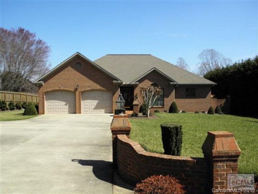 What an awesome, all brick ranch style home, with spacious double garage and terrific basement workshop and storage area.  The home has architectural shingles and commercial guttering.  The beautiful interior of the home has hardwood floors with the exception that the Master Bedroom is carpeted and the baths have tile flooring. The breeze way between the living room and dining room is supported by columns throughout.  The oak kitchen cabinets are beautiful as are the granite counter tops.  All kitchen appliances remain.  The recessed lighting adds to the homes beauty. There is a 16 speaker system throughout the house and workshop. Every closet has partial cedar lining, and there are 2” wooden blinds throughout.  The Master bedroom and Living room has tray ceiling and the Dining room ceiling is vaulted.  There is a gas log fireplace and beautiful mantel, and a separate laundry room w/sink.  There are two bricked patios, one off the kitchen and a very large one in the rear.