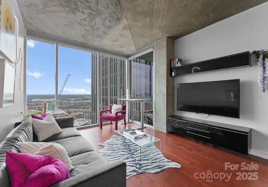 Own a piece of Charlotte's growing skyline! This pristine high-floor, corner unit at Avenue Condominiums features contemporary finishes while giving you the best of Uptown living. Situated in the Historic 4th Ward district, enjoy proximity to an array of cultural experiences, professional sports venues/events, and exciting dining options. The welcoming entryway leads to a bright, open-concept living, dining, and kitchen area. This unique condo provides a true 1-bedroom layout with a door and stunning city views! The spacious unit includes a modern kitchen with granite countertops, stainless steel appliances, and custom closets in the owner's suite. Enjoy a brand new HVAC, water heater, and electric blinds. The building boasts some of Uptown's finest amenities: a 24-hour concierge, secure access, clubhouse, billiards room, outdoor spaces with grill & fireplaces, a stunning lobby with a water-wall feature, an elevated swimming pool, a state-of-the-art fitness center. Welcome home!