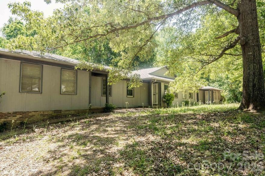 Investors dream!  Quadplex that is vacant and ready for your updates and renters.  Located at the end of a dead-end street in Boger City.  Great rental potential.  All units are 2 bedroom, 1 bath.  One end unit has a fireplace and handicap ramp.  City water and septic tank.  Priced to sell.