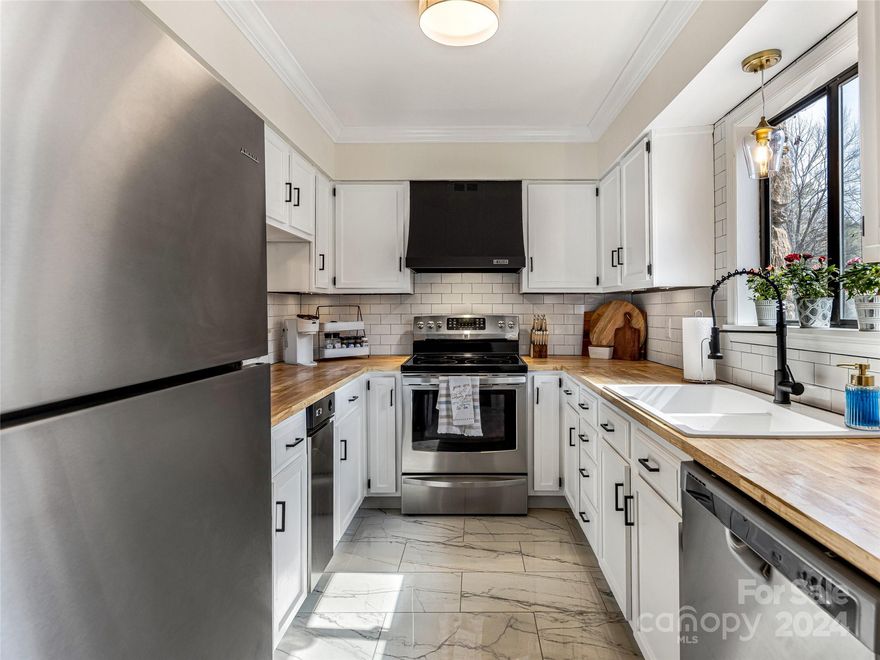 This delightful ground-level condo boasts 2 bedrooms, 2 bathrooms, and a host of modern comforts. Step inside to discover an updated kitchen and bathrooms, where sleek finishes and contemporary design elevate the living experience. Cozy up by the wood-burning fireplace in the spacious living area, perfect for chilly evenings or fun gatherings. This fantastic floor plan maximizes space and flow, creating an inviting atmosphere throughout. Whether you're enjoying a quiet evening indoors or entertaining guests, this condo offers the perfect blend of comfort and convenience. Located within the close-knit Cedar Forest community, a helping hand or a spare cup of sugar are never far. Enjoy days spent by the pool or attending neighborhood block parties. With its centralized location in South Asheville, this cozy home is the perfect gateway to all that Asheville has to offer. Don't miss your chance to call this South Asheville gem home!