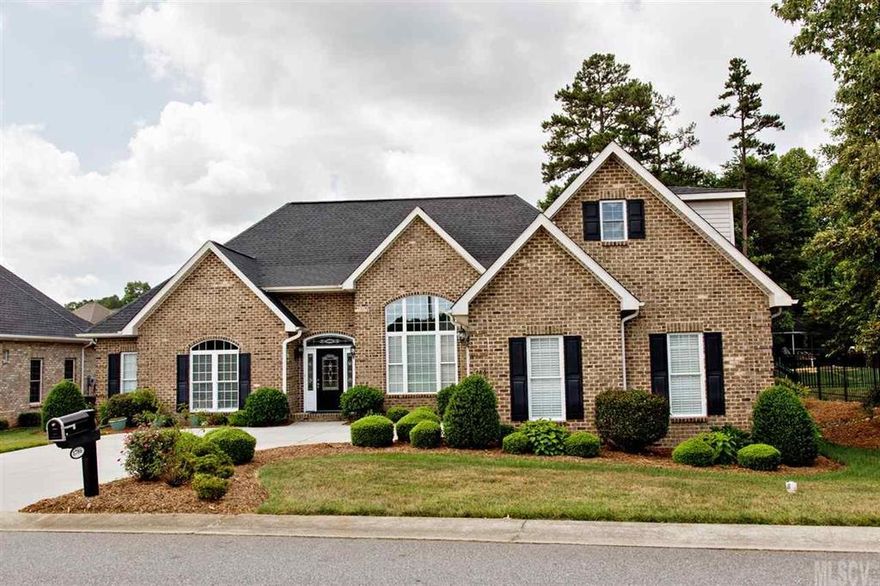 This home is ready to move right in. Full brick ranch loaded with quality features throughout. Open floor plan with formal dining room and vaulted great room with gas fireplace. Hardwood flooring, crown molding, spot lighting & neutral colors throughout. Split bedroom plan with master bedroom on right. Master bath has jetted tub, separate shower and dual vanity. The large open kitchen has granite counter tops and stainless steel appliances. Breakfast nook leading to deck area for outdoor entertaining with grill already in place on natural gas line. Two additional bedrooms on the left end of the home with full bath. Office on main level and bonus room or fourth bedroom on upper level. Walk-in laundry on main level. This one is a must see if you are looking for quality throughout.