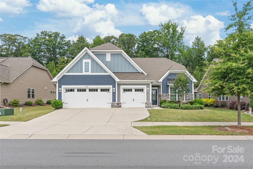 1-story home with outstanding floor plan and lot. This is a terrific home! Gorgeous finishes throughout. Kitchen features a huge 10' island, white cabinets, double oven and gas cooktop. Kitchen is open to a beautiful great room with stone fireplace and attractive built-in cabinets. 3-car garage included!  Bathrooms feature painted cabinets and granite countertops. Upgraded light fixtures throughout. Inviting screen porch and paver patio in the back. Backyard is beautifully landscaped and very private: one of the best lots you can find in the neighborhood! Lot backs up to trees. And the home is only steps away from the community lake and walking path, leading to the neighborhood amenity center. Tree Tops is a gorgeous neighborhood with lots of activities available for homeowners. Don't miss this special property!