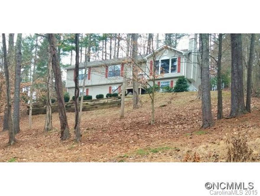 Meticulous home on large lot with winter views-just 5 mins from Main St. Weaverville & easy 15 min. drive to Asheville. Open plan with vaulted ceilings, hardwood floors & gas fireplace in living room. Eat-in kitchen with stainless appliances. Generous bedrooms with large closets. Big family room & nice laundry room on terrace level. Fantastic deck for entertaining in private back yard. Oversized 2 car garage with workshop area & lots of storage.