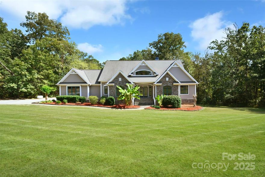 A Rare Private Estate on 19 Acres in Prime Huntersville Location! Tucked behind a gated entry on over 19 acres across 3 parcels, this custom-built estate offers an unmatched blend of privacy, space, and proximity—just minutes to Charlotte and Lake Norman. This is a rare opportunity to own expansive land without sacrificing convenience and the home offers a brand new HVAC system installed 2025. The main level welcomes you with a soaring great room, elegant dining area, and a warm, functional kitchen. A spacious laundry room, private study, and a luxurious primary suite with dual walk-in closets and a spa-inspired bath—including a soaking tub and newly updated shower—complete the main floor. The lower level features two en-suite bedrooms, a second great room, a mini kitchen, and an incredible man-cave with ample storage. Outside, a two-story deck offers unparalleled tranquility. Explore the land with ease thanks to multiple outbuildings and space for ATVs. Whether you're dreaming of building more, enjoying nature, or entertaining in style—this exceptional property delivers.
