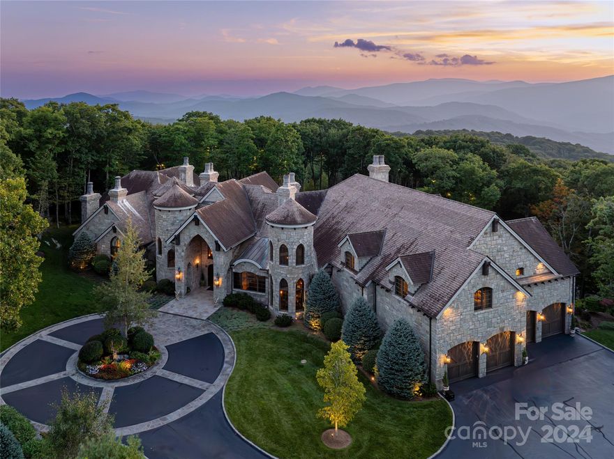 Discover the pinnacle of mountain living!  This magnificent crafted marvel on 7.64 private, landscaped acres within the gates of Elk River. Designed with architectural brilliance and unparalleled craftsmanship. The expansive great room showcases stunning wood and stone elements, soaring ceilings, and a complete bar for entertaining overlooking the dining area with detailed fireplace.The gourmet kitchen features top-tier appliances, custom cabinetry, and opens to a generous screened porch perfect for outdoor living. Retreat to the primary suite with its spa-like bath, including a waterfall shower and soaking tub with views. The home offers two offices, a library, a theater, personal gym and two elevators for ultimate convenience. The custom wine cellar with leaded glass is a wine lover's dream. The beautifully landscaped grounds create a serene, private retreat. This estate is a perfect blend of elegance and comfort, offering a truly lavish lifestyle.Not one inch was overlooked!