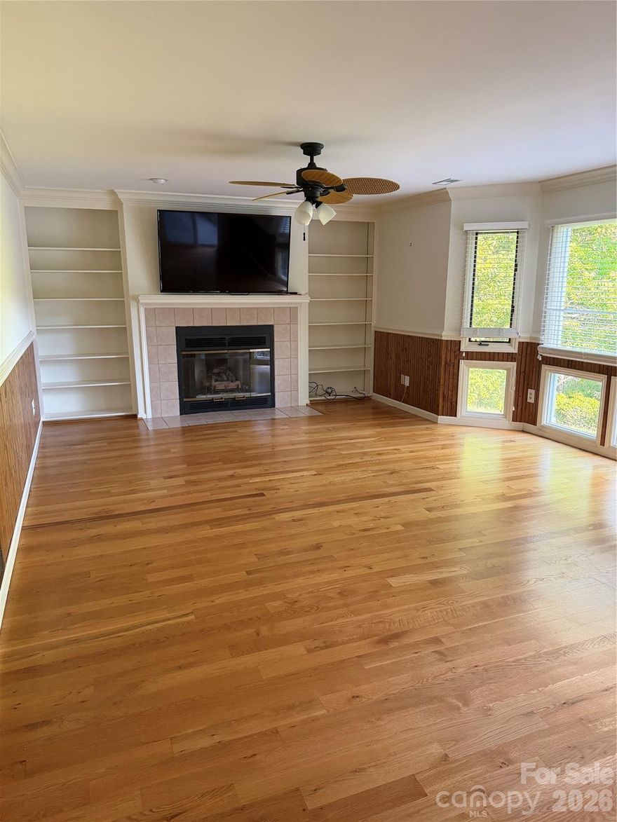 Experience Mountain living in Western North Carolina in this magical community of Kenmure.   A 24-hour live security gated community.  This split floor plan: 2 bedroom, 2 full-baths, has all the comforts with a screened-in porch and views. Unit has wood floors throughout the unit. Several sliding glass doors, allowing access from the living room, dining room and master bedroom. The master en-suite offers a large walk-in closet, master bath with double vanities and a larger walk-in shower. Enjoy golf club living at Kenmure: 18-hole golf course with new Top Tracker range; indoor and outdoor pools; tennis and pickleball courts; bocce ball; fitness center and so much more.  Double carport is shared with the upper unit, and additional guest parking is available. Charming Flat Rock Village offering quaint shops and neighborhood restaurants. Minutes to downtown Hendersonville.