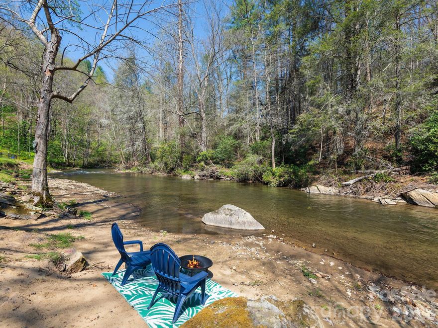 Waynesville NC creekside home • 2BR/3BA • Jonathan’s Creek • Fully Renovated • Separate lower-level living quarters • Open-concept main level • Hot Tub • Short Term Rental Potential

Set along Jonathan’s Creek, this fully renovated property delivers the kind of lifestyle that’s hard to find and even harder to leave—fly-fishing right outside your door, multiple decks for hosting, and the constant backdrop of flowing water.

Inside, the home has been completely reimagined with a bright, open layout that lives easily and entertains even better. The upstairs kitchen features granite countertops, soft-close cabinetry, and updated finishes, while every bathroom has been renovated—including the addition of a lower-level shower for added functionality.

What truly sets this property apart is the fully equipped lower-level living space. With its own entrance, living area, kitchenette, full bath, laundry, and bonus room, it’s perfectly suited for guests, multi-generational living, or generating rental income. Whether you’re looking for flexibility or ROI, this setup delivers.

Outdoor spaces are where this home really shines—a brand-new Trex front porch, expansive party deck with its own bathroom and outdoor shower, and a lower deck overlooking the creek with a hot tub already in place. This is the kind of setup buyers picture when they say they want a “mountain getaway.”

Major updates are already handled, including a new roof and HVAC, along with retaining walls, updated doors and sliders, mini-splits, and fresh exterior paint—making this a true move-in-ready opportunity.

If you’ve been waiting for something turnkey, flexible, and directly on the water—this is it.