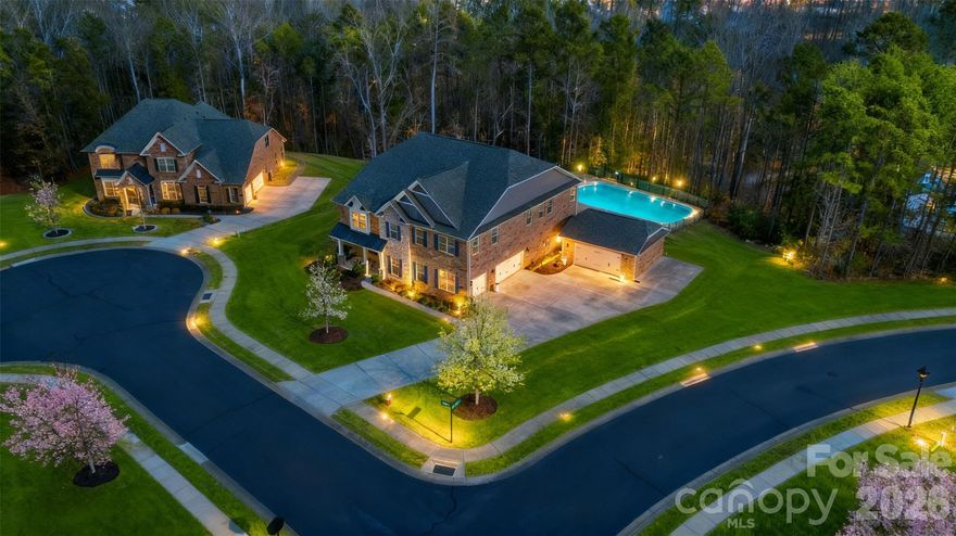 LOCATION, LOCATION! Rare 5 Bedroom, 4 1/2-bathroom, 5 car garage home on a 1-acre lot located in gated Bretagne community.  Just minutes from the Bowl at Ballantyne, 30 minutes from the Airport and Uptown Charlotte with access to 485, 521, shopping, eating places, Target & Costco in Indian Land. The expansive 1-acre homesite offers excellent potential for a future pool, giving added entertainment/relaxation space and flexibility. This MULTI-GENERATIONAL property offers the perfect blend of convenience, and modern comfort. This home welcomes you with 10’ ceilings, 8’ doors, wood flooring, and an open-concept layout. 

Features a stunning gourmet kitchen with a large granite island, 42" stacked cabinetry, pot filler, stainless appliances, and abundant storage. The kitchen flows seamlessly into a coffered-ceiling great room with a warm, inviting fireplace—perfect for everyday living and entertaining.

With 5 bedrooms and 4.5 baths, this home offers exceptional flexibility and privacy. Four of the five bedrooms include their own attached ensuite bathrooms, creating comfortable retreats for family and guests. 

Exterior living is equally impressive, offering a screened porch, fire pit, and a spacious paver patio, built-in grill, designed for relaxation and gatherings. Full irrigation system and landscape lighting add both functionality and value to this already exceptional property.

If you’re looking for a Fort Mill home with space, privacy, accessibility, and unbeatable proximity to Ballantyne and Charlotte, this residence delivers a lifestyle that’s hard to match.