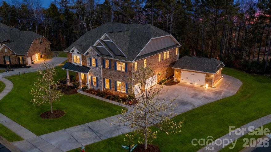 LOCATION, LOCATION! Rare 5 Bedroom, 4 1/2-bathroom, 5 car garage home on a 1-acre lot located in gated Bretagne community.  Just minutes from the Bowl at Ballantyne, 30 minutes from the Airport and Uptown Charlotte with access to 485, 521, shopping, eating places, Target & Costco in Indian Land. The expansive 1-acre homesite offers excellent potential for a future pool, giving added entertainment/relaxation space and flexibility. This MULTI-GENERATIONAL property offers the perfect blend of convenience, and modern comfort. This home welcomes you with 10’ ceilings, 8’ doors, wood flooring, and an open-concept layout. 

Features a stunning gourmet kitchen with a large granite island, 42" stacked cabinetry, pot filler, stainless appliances, and abundant storage. The kitchen flows seamlessly into a coffered-ceiling great room with a warm, inviting fireplace—perfect for everyday living and entertaining.

With 5 bedrooms and 4.5 baths, this home offers exceptional flexibility and privacy. Four of the five bedrooms include their own attached ensuite bathrooms, creating comfortable retreats for family and guests. 

Exterior living is equally impressive, offering a screened porch, fire pit, and a spacious paver patio, built-in grill, designed for relaxation and gatherings. Full irrigation system and landscape lighting add both functionality and value to this already exceptional property.

If you’re looking for a Fort Mill home with space, privacy, accessibility, and unbeatable proximity to Ballantyne and Charlotte, this residence delivers a lifestyle that’s hard to match.