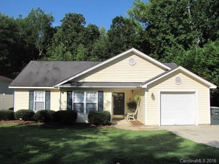 Come enjoy single-level living in this cute ranch, located in a quiet neighborhood just minutes from shopping and dining! The focal point of the family room is a lovely fireplace with a marble surround and a TV niche above. The galley kitchen is open to a sunny breakfast area with vaulted ceilings, and sliding doors that access the rear patio with serene wooded views. The master bath features a dual sink vanity, a garden tub and a shower. Don't miss this adorable home at an affordable price!