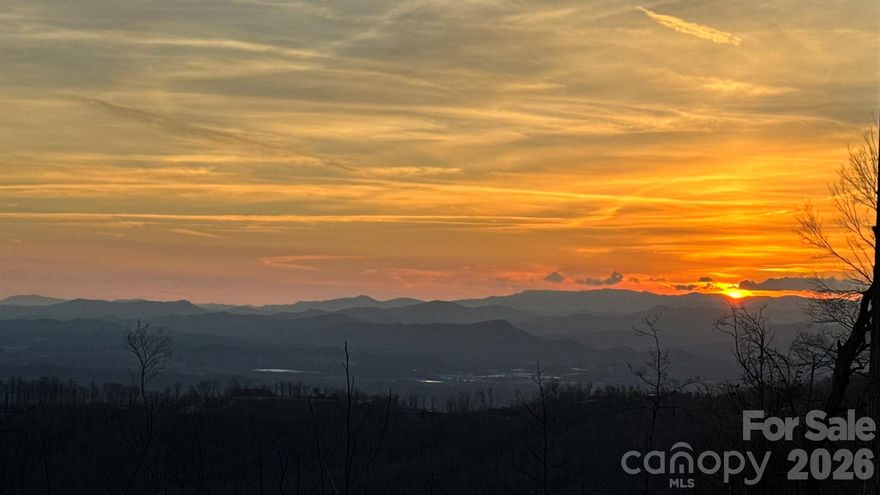 Welcome to homesite 33 in the gated community of Sprout. Located near the summit, this spectacular homesite is ready for your mountain dream home. This gently sloping 2.6 acre lot offers spectacular unobstructed, multi-layered, panoramic views of the Blue Ridge Mountains. Facing south/southwest you have the best exposure for natural and direct sunlight throughout the day, and you get to enjoy endless sunsets. Also, from the front of the home, you'll experience refreshing sunrises each morning. It has been perked for a 5 bedroom septic and trees have been cleared, ready for construction. Both neighboring homes are nearing completion, offering the benefit of established surroundings while still allowing you to customize your own build. The community of Sprout is situated between Hendersonville and Asheville, making everyday conveniences a breeze. Only 20 minutes to the Asheville airport and 15 minutes to all downtown Hendersonville has to offer. Explore 5 miles of private trails, plant a harvest in the community gardens or learn to bee keep on the property's 2 apiaries. Sprout is a master-planned community on over 400 acres with only 73 total homesites, giving each owner privacy and serenity.