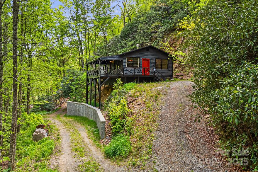 Charming 2 bed/1 bath mountain cabin on 1.6 acres just minutes to downtown Black Mountain! Enjoy privacy, nature, and convenience at this cozy abode. Perched high and dry above the Broad River with a stunning rock outcropping in the backdrop, this home offers a peaceful setting surrounded by natural beauty. Ideal for buyers who value serenity, nature, and being a part of Black Mountain’s resilient and welcoming community. MAJOR recent improvements including a new well, engineered foundation system, updated electrical, new HVAC, new gutters & fresh exterior paint. Move right in and add your own interior touches!