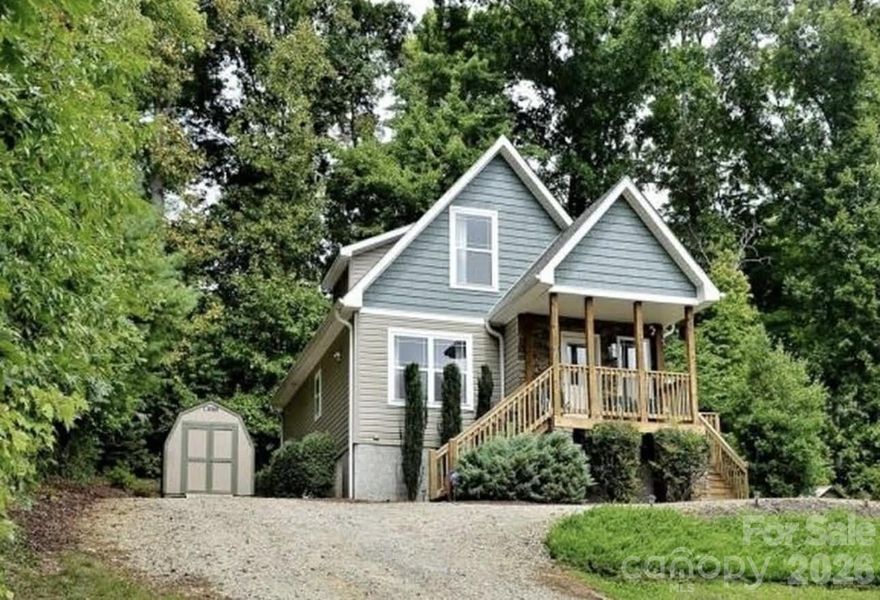 Charming home offering the perfect blend of peaceful country living with convenient access to nearby amenities. Situated on a nicely landscaped lot surrounded by mature trees, this property provides a private and inviting setting.

The home features 3 bedrooms and 2 full baths, with the primary bedroom located on the main level for added comfort and convenience. The interior is light and bright, creating a warm and welcoming atmosphere throughout. The kitchen is designed with functionality in mind, offering ample counter space and cabinetry, and flows easily into the main living areas.

Outdoor spaces include a covered front porch and a side deck, ideal for relaxing or entertaining. A detached storage building adds exceptional value, complete with electricity and air, making it perfect for a workshop, hobby space, or additional storage.

This property offers a rare opportunity to enjoy quiet country living without sacrificing convenience sitting on a half acre of land.