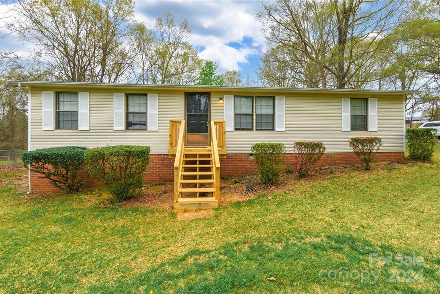 Discover comfort and charm in this inviting 3 bedroom, 2 bathroom home nestled on a generous half-acre lot. The kitchen boasts a cozy breakfast area and a window over the sink, offering views of the outdoors. Recent updates include new flooring in the main living areas and new carpet in the bedrooms, adding a fresh touch to the interior. Retreat to the primary bathroom, which has been beautifully updated to feature a large floor-to-ceiling tiled shower. Outside, the spacious yard offers endless possibilities and includes a convenient shed for extra storage. Experience the perfect blend of comfort and functionality in this lovely home!