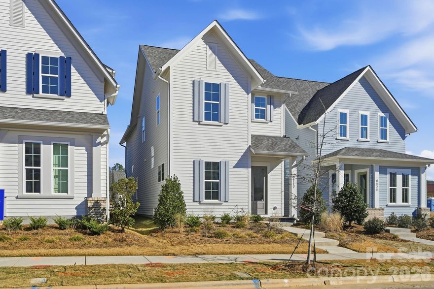 NEW CONSTRUCTION in East Charlotte - This outstanding home has an open design with 10' ceilings & 8' doors/cased openings on the first floor, a beautiful kitchen w/quartz counter tops, center island & under cabinet lighting. Huge walk-in pantry w/ventilated shelving provides generous storage. Electric fireplace w/mantle & floating shelves in family room. Luxury vinyl plank flooring on main level. Drop Zone w/lower seat, upper shelf, brackets & hooks. Primary bedroom on upper level with LVP flooring, full bath, double vanity, oversized tiled shower & walk-in closet. Cabinets in laundry room above washer/dryer location. 9' ceilings on upper level w/2 guest bedrooms (both with walk-in closets). Hall bath has tub/shower combo & ceramic tile walls & flooring. Covered rear porch designed for relaxed evenings. 2-car detached garage w/ electric car pre-wire - rear loading with alley access. Ring doorbell & camera w/Yale door lock. Front lawn maintenance & irrigation covered by HOA.
