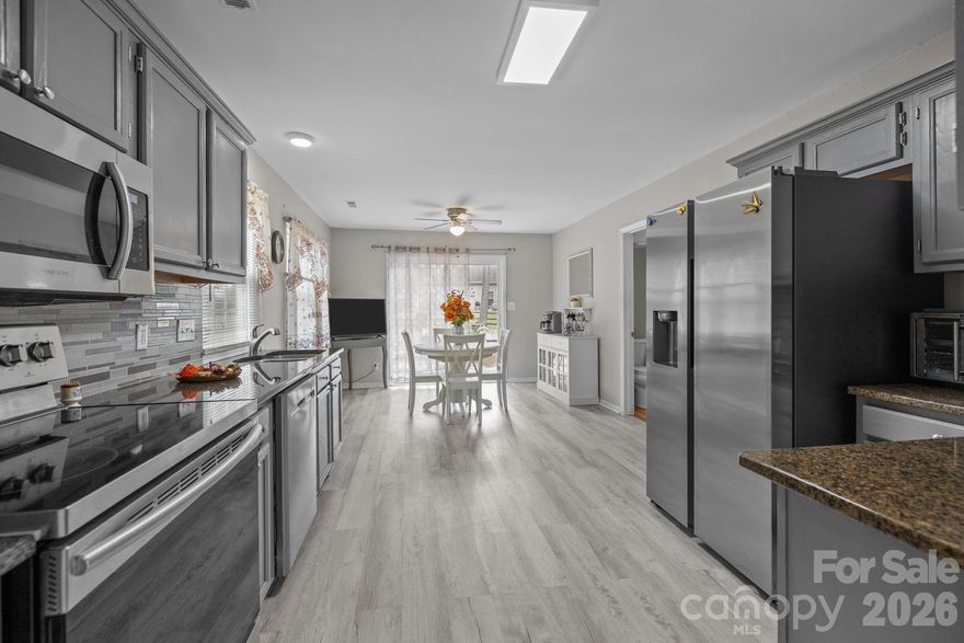 REDUCED $9,900.00!  SELLER HIGHLY MOTIVATED!  BRING YOUR BEST OFFER!
Nicely Updated 3 Bed 2.5 Bath Home on .23 Acres tucked away in Morris Village...Great Location w/No HOA!

Brand-New Gas Furnace/AC installed Sept. 2025, ensuring peace of mind, energy savings, & an excellent investment opportunity!  New updates include interior door hardware, stairwell/hallway lighting, plus bedroom carpets replaced approx. 2 years ago & still fresh!  Fresh, Unfaced Fiberglass Insulation installed in Utility Room w/older Gas Water Heater.

Spacious Eat-In Kitchen (updated 2019) is a great place to start your day w/heavy Sliding Glass Doors (New Vertical Blinds installed Oct.'25), Smooth Ceilings, LVP Flooring, Granite Countertops w/Tile Backsplash, & Quality Stainless Steel Appliances includes 2024 SS Samsung Fridge.

Connecting Laundry Room includes a 2025 Whirlpool Front Load Washer/older Dryer, ample Shelving, & a self-standing Cabinet.
  
Wood-Burning Fireplace Insert w/a traditional Raised Brick Hearth, Prefinished Hardwood Flooring & included TV above the Mantel completes this Cozy Living Room.

Tired of the open concept design?  Schedule a showing and see how cozy this feels!
Better sound control.  Better organizational concept.
Smart and Functional Floor Plan...Stairwell to the back adds perfect Feng Shui.  Laundry Room and Powder Room are true bonuses in 1300 square feet!

Fresh, Unfaced Fiberglass Insulation installed in Utility Room w/Gas Water Heater.

Mature Trees, Relaxing Rocking Chair Front Porch & a Spacious Fenced Backyard w/Tool Shed completes this home sweet home, well cared for by the same owner since 1993.

Mint Hill Vibe w/Charlotte address offers affordable living w/low taxes.  Schools & shopping just around the corner. Nice connect to Matthews. Approx. 10 miles to Uptown Charlotte!

Personal items to convey...Refrigerator, Washer, Dryer, Outside Shed, Outside Hanging Lights, Tall Storage Cabinet in Laundry Room, TV over Fireplace, & Satellite Dish.