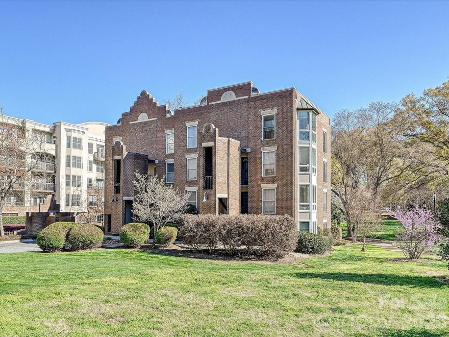 Hidden Gem in Fourth Ward Park! This charming top-level, two-story end-unit condo is nestled in the heart of Fourth Ward with abundant natural light from multiple bay windows. 2 deeded parking spots just steps away from the building. Thoughtfully updated throughout, it features an open floor plan with a renovated kitchen, stainless steel appliances, hardwood floors, exposed beam ceilings, custom built-in storage throughout, and a cozy fireplace. The spacious primary suite includes a large bath with a soaking tub and separate shower. Enjoy a private balcony overlooking the park, two parking spaces, and low monthly dues. Refrigerator, washer, and dryer are included. Low HOA dues. All of this just steps from restaurants, grocery stores, shops, and sports venues—experience the best of uptown Charlotte living!