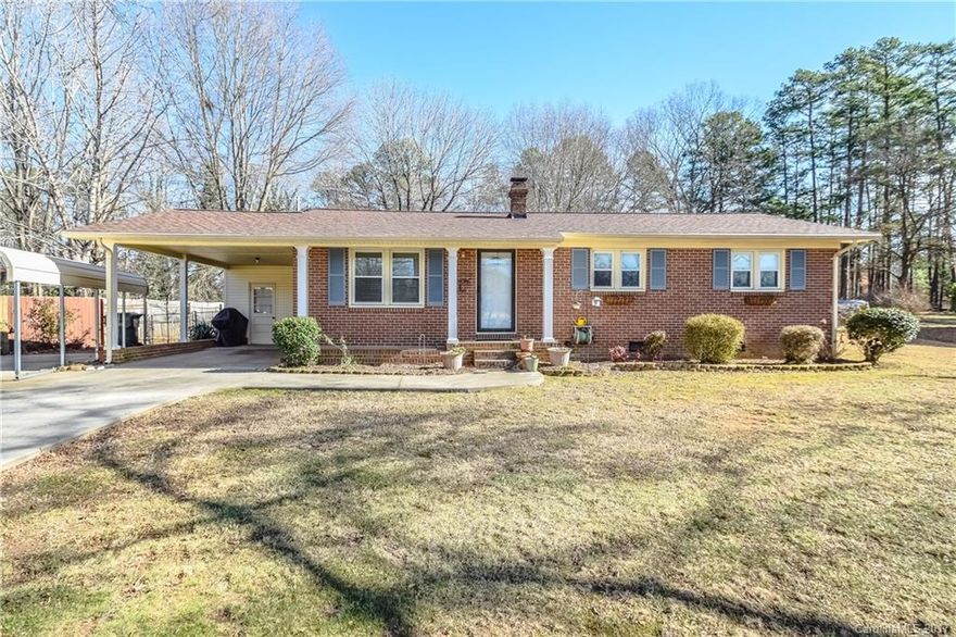 Full brick home on level .61 acre lot with pretty trees, fenced yard, hot tub, and storage shed. 1 attached carport as well as 1 detached carport. New windows 2014, new HVAC 2007 new roof 2016. 2 " faux wood blinds, per seller hardwoods under carpet! New dishwasher. Master bedroom has en suite powder bath. Laundry is in utility room! Convenient to I-85 and Hwy 29. Cabarrus County schools!!