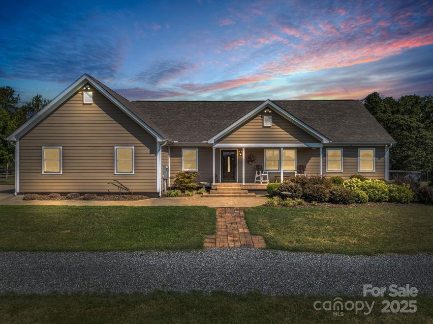 Welcome to 609 Green Creek Dr. in Columbus, NC! Built in 2019, this meticulously maintained 3-BR, 2-bath home with a large screened in porch offers 1,899 sq. feet of living space. This 4.97 acre property is fully fenced & gated. This turnkey mini horse farm blends modern living with exceptional equestrian amenities.

The home features an open floor plan, spacious rooms, a 2-car garage, and a whole-house generator for added peace of mind. Outdoor features include a 3-stall barn with wash rack & air-conditioned tack room, a round pen, hay storage, a manure pit, a run-in shelter, & lush pastureland—ideal for horses or other livestock. A detached shop provides additional space for storage, hobbies, or equipment.

Located in desirable Polk County, this property offers privacy, functionality, and convenient access to local equestrian centers, riding trails, and town amenities. A rare opportunity for horse enthusiasts or anyone seeking a peaceful rural lifestyle with modern conveniences.
