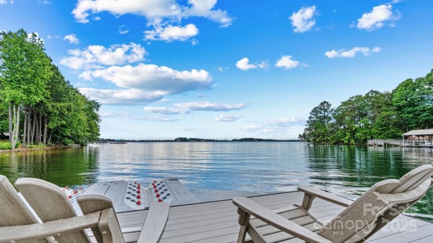 Location! Location! Chic Farmhouse Retreat nestled on a full acre along a peaceful stretch of Lake Norman’s southwestern shoreline. This 4-bedroom, 4-bath charmer is full of warmth and character with stylish finishes and a relaxed, welcoming feel throughout.

The living room with fireplace, sunroom with water views, dedicated dining room, and spacious laundry/mudroom are all thoughtfully designed for easy lake living. Outdoor features include two expansive porches, a flagstone patio with grill and firepit, private beach entry, boat dock with personal watercraft docks, and an irrigated yard — perfect for relaxing or entertaining.

Located in the “sweet spot” of Denver - near Cowans Ford Golf Club, Birkdale Village, 485, Huntersville and Charlotte Hospitals— this home is perfectly positioned for both adventure and convenience. Set apart from through-traffic, it offers added peace and space. Start with a sunrise paddle and end with a sunset dinner cruise. LKN Sailing Club 10 mins away