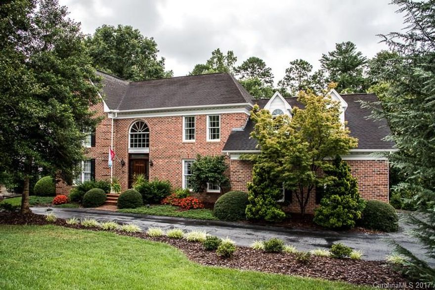 All Brick Moores Ferry home situated on .54 acre, gorgeous lot w/brick patio & pergola & outdoor kitchen offers a peaceful & private retreat! Large kitchen w/custom cabinets & granite counters, breakfast nook that access den w/gas FP & wet bar/entertainment cabinet. Formal DR, main level guest room w/full BA, laundry room & sitting room. 2nd level offers spacious MBR suite, 3 add'l BRs & full bath. Basement offers a hobby room, media area, den w/gas FP, single garage & add'l storage room