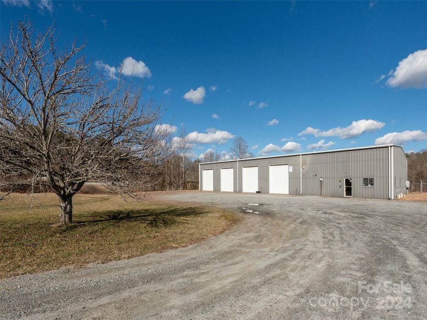 Great production, construction, vehicle service or cross-docking warehouse well suited for a myriad of uses including heavy duty truck, RV or auto service, recreational outfitting, brewery, government or construction operations! Located between Mills Rive and Brevard on NC Hwy 280, this 8,400 sqft facility features 18" ceilings, clear span interior, 3-ph power, 8-12'w x 14'h roll-up doors, sunken vehicle service pit & 1200 sqft office.  The level, 3 acre site borders WNC Wildlife Commission compound and the location is 5 to 21 minutes drive-time to Pisgah National Forest, Davidson River campground, DuPont State Park, the city of Brevard, Brevard College & the Asheville Airport!