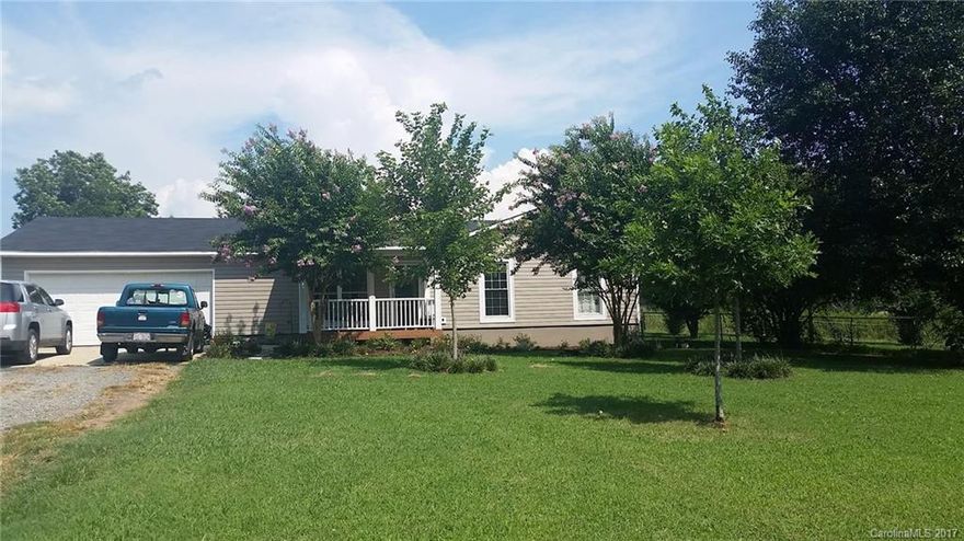 Check out this new listing in Union County. Desirable schools and convenience to I-485 add even more value to this 3 bedroom - 2 bath home. 1.5 fenced in acres surround this well kept property. New roof and vinyl siding with beautiful landscaping, two car garage and a 12x24 storage building highlight the exterior; and an open living floor plan with new paint and flooring make this starter home the best on the market. Bring your pets and enjoy country living in the heart of Union County.