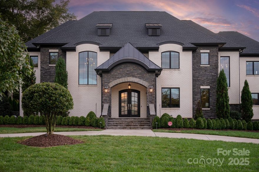 Newer build (2019) home in gated Providence Downs South w/ 4 car garage & circular drive. Primary suite on main floor & 2nd floor. Kitchen features a large 9 foot island, huge walk in pantry w/ custom cabinets & fridge + Wolf appliance package including double ovens, gas cooktop, commercial hood, microwave + steam microwave, built in coffee station, built in fridge +wine fridge! HUGE laundry room on main w/ custom ceiling to floor cabinetry, folding station & convenience office. Upstairs features an additional primary suite w/ balcony & spa like oversized bath w/ free standing garden tub and luxury shower. Upstairs also includes 3 oversized en suite secondary bedrooms + a large bonus room w/ built in cabinetry, beverage fridge & sink. Enjoy the weather from the covered porch w/ fireplace! Backyard features a large contemporary pool, outdoor kitchen and full cabana bath. Oversized attached 2 car garage and 880sf detached garage perfect for your home gym!