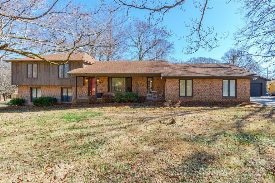 Nestled on a spacious 0.85-acre corner lot, this tri-level home offers a well-designed layout with plenty of room to live & entertain. The beautifully updated kitchen features quartz countertops, a large island, and double convection ovens. Upstairs, all 3 bedrooms provide a private retreat, while the lower level includes a cozy den with a wood-burning fireplace, a recently remodeled half-bath, an office, and a large storage room/flex space. The lot is graced with muscadine vines & dogwoods, adding charm & tranquility. The expansive backyard is surrounded by a privacy fence & includes a large deck, perfect for gatherings. A huge detached garage/workshop, complete with its own power meter, offers endless possibilities. Thoughtful updates, including PVC plumbing & new electrical panels, ensure peace of mind. Located less than 10 minutes from the interstate, shopping & dining, while benefiting from county taxes! Don’t miss the opportunity to own this impressive home on a fantastic lot!