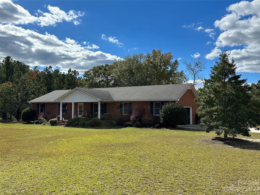 If you are looking for a brick ranch, located on 3.56 ACRES, in an established rural neighborhood, that has easy access to Pageland area amenities, this one may be for you!  It features a spacious living room leading to the front covered porch, kitchen/dining room, that leads to the enclosed rear porch, laundry/mud room with direct access to the side load two car garage/storage, primary bedroom/bathroom, and two other bedrooms with easy access to the full hall bathroom. There is a rear fenced yard area, detached storage, along with lots of room to roam on this acreage!