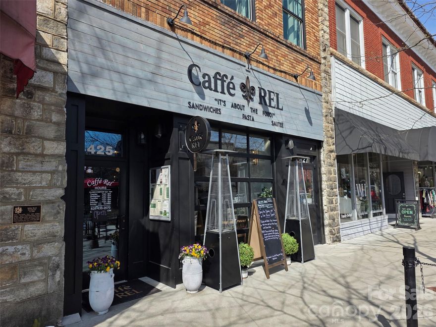 Income-Producing Asset in the Heart of Downtown Hendersonville.  Secure a cornerstone piece of Western North Carolina real estate. Located on one of the most vibrant and high-traffic "Main Streets" in the region, this historic building offers a rare combination of architectural character and modern, turnkey performance.  Investment Highlights: Proven Passive Income: The property is currently under a long-term lease with a reliable, established tenant (Café REL), providing immediate cash.  Recent Capital Improvements: Benefit from peace of mind with a total interior and exterior improvement completed within the last 2 years. The space is modern, efficient, and fully optimized for high-volume commercial use.  Unbeatable Location: Situated in the 400 block of N. Main Street, the building enjoys elite foot traffic and visibility within Hendersonville’s Central Business District, a destination famous for its year-round tourism and local patronage.  Future Upside & Expansion: While the sale currently focuses on the commercial ground floor, the building also features a successful Airbnb unit upstairs. While not included in the initial offering, the owner is open to discussing the sale of the upper level at a later date, providing a unique path toward full building ownership.  Property Specifications: Square Footage: 3,043 sq. ft. of meticulously maintained space. History Meets Modernity: Originally built in 1896, the structure retains its historic charm while featuring updated electrical, plumbing, and HVAC systems.  Accessibility: Fully compliant with modern standards, featuring level entry, wide door clearances, and accessible restroom facilities.