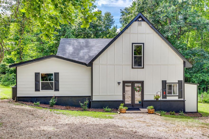 Welcome to your own private oasis on 5 acres of beautiful land, complete with a charming walking trail that winds through the property. This unique offering includes a remodeled main house and a cozy tiny house, providing endless possibilities for living and entertaining. The main house has an updated spacious kitchen and a massive living area. The primary bedroom has a large walk-in closet, a sunken tub, and a walk-in shower. Upstairs are two additional bedrooms and a Juliette balcony. New HVAC and well is 2 years old. The Tiny house is a delightful bonus, offering a cozy retreat for guests or a peaceful workspace away from the main house. With its own kitchenette and bathroom, this space is both functional and inviting.