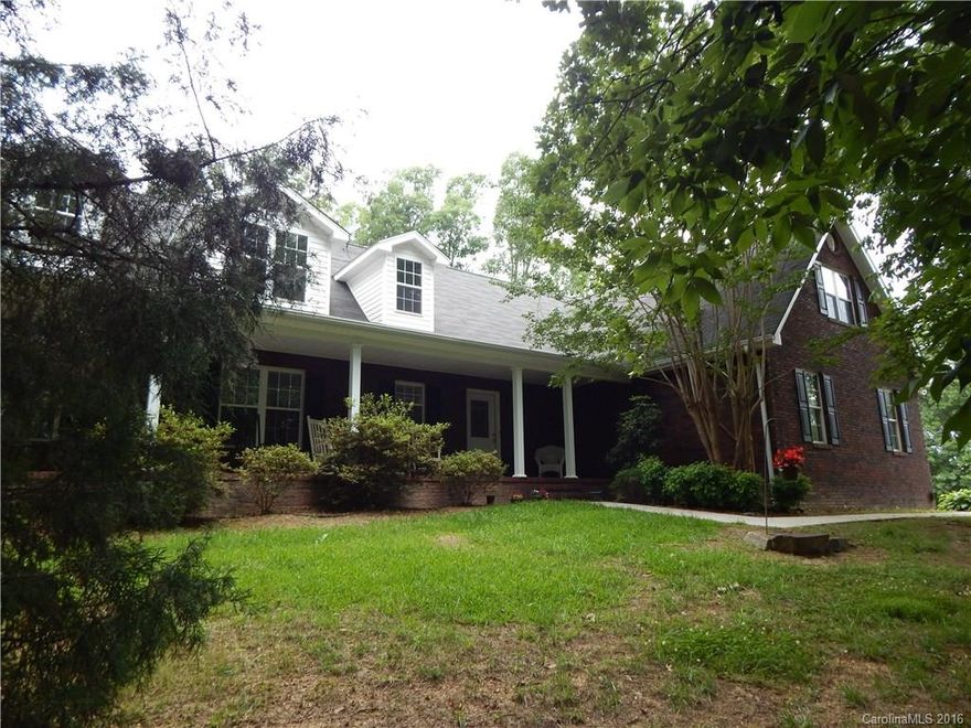 Private Setting, 2.46 Acres in the woods, Built in 2003, this All Brick 1.5 Story Home has BIG Front Porch and nice back deck!  Located just outside Stanfield, NC.  Open, spacious floor plan with sparkling hardwood floors in common areas. Lots of windows and light inside.  Nice master with fancy bathroom, separate shower and whirlpool tub.  Beautiful open kitchen with Natural GAS range, furnace, fireplace and water heater! 
Two car attached garage, mostly wooded lot with some grassy areas.