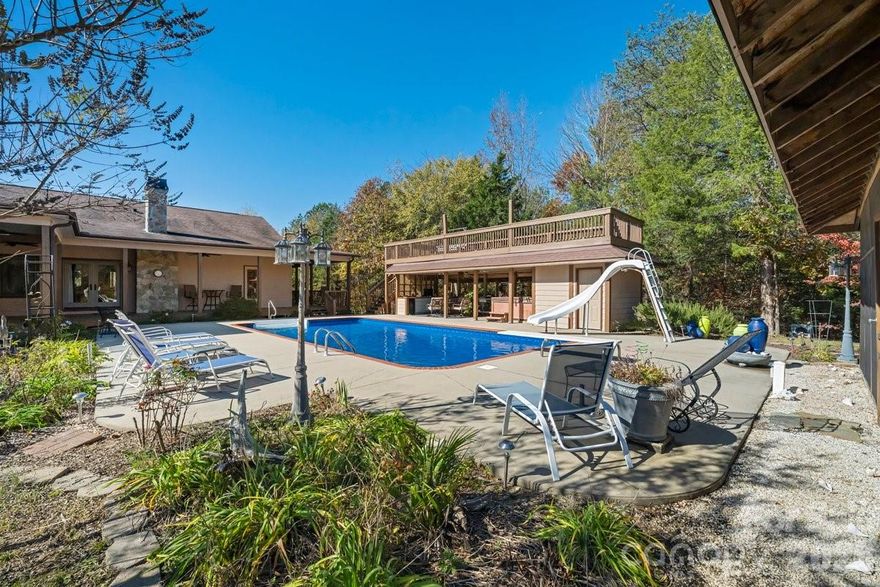 Discover the perfect blend of privacy, comfort, and convenience with this extraordinary 72-acre farm estate—peacefully secluded yet located within an hour of Greenville, Charlotte, and the Tryon International Equestrian Center. Designed for those who value both refined living and the beauty of nature, this property offers a rare opportunity to enjoy country serenity without sacrificing accessibility.
The main residence features 5 spacious bedrooms and 4½ baths, each bedroom thoughtfully designed with its own exterior door, inviting you to step outside and take in the tranquil surroundings. Inside, you’ll find three elegant fireplaces, five walk-in closets, and two fully equipped kitchens, perfect for entertaining or hosting guests.
Enjoy year-round relaxation in the spa room, complete with a radiant heat sauna, or take a dip in the heated saltwater pool. Adjacent to the pool, a screened poolside room and outdoor kitchen provide an ideal setting for gatherings and quiet evenings under the stars.The property is a haven for nature lovers, featuring abundant wildlife and approximately 50 fenced acres, ideal for horses or livestock. The two-story barn offers endless possibilities for equestrian or agricultural use, while the charming 2-bedroom, 1-bath caretaker’s cottage provides additional living space for guests or staff.
Every detail of this estate speaks to both practicality and luxury. As an added option, the owner is willing to include a 48hp Massey Ferguson tractor with implements for a turnkey farming experience.
Whether you envision a private family retreat, a working farm, or an equestrian paradise, this remarkable property offers it all—peace, space, and timeless country elegance and YES there is cows waiting for you.
Schedule your private tour today and experience the beauty and tranquility of this one-of-a-kind Southern estate.