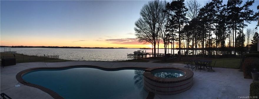 Breathtaking views!  Amazing waterfront home on fabulous lot.  In ground pool, boatlift, jet ski lift, almost flat lot.  Wonderful location, Iredell county taxes, but convenient to Davidson, Huntersville, Cornelius, & a short drive to Charlotte.  Views from the entire backside of the house!  Master is oversized & has large sitting area, his & her closets.  Sunroom has guest half bath.  A must see!
