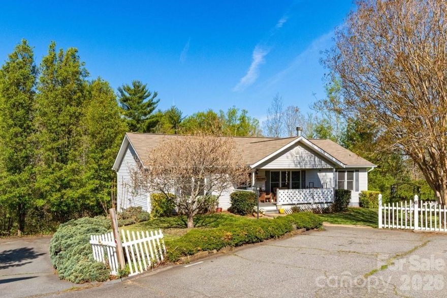 Tucked at the end of a peaceful cul-de-sac in desirable Weaverville, 6 Arrowhead Lane offers the perfect blend of privacy, flexibility, and mountain charm—just 2.5 miles from Main Street’s beloved local spots like Well-Bred Bakery and Twisted Laurel.

The main level welcomes you with an open-concept living and dining area featuring vaulted ceilings, a cozy fireplace flanked by built-ins with custom surround sound, and abundant natural light. The kitchen is both stylish and functional with granite countertops and a tile backsplash. The spacious primary suite includes a dual vanity, walk-in closet, and beautifully tiled bath, while two additional bedrooms and a full bath provide comfortable accommodations for family or guests. Step outside to enjoy a screened porch wired with surround sound, and expansive deck with seasonal mountain views—perfect for relaxing or entertaining.

Downstairs, a versatile lower level offers incredible potential for rental income or multigenerational living, complete with a private exterior entrance, studio-style living/sleeping space, kitchenette, full bath, sunroom, and an oversized heated artist’s workshop. A covered back deck adds even more outdoor enjoyment. Furniture is negotiable.

Set on a generous 0.84-acre lot with a flat front yard and back yard with fire pit, this property offers space to play, garden, or simply unwind in a serene setting—while still being just minutes to shopping, dining, and an easy drive to Asheville.

Whether you're seeking a primary residence with income potential or room to grow, this home delivers. Schedule your showing today and discover all the possibilities waiting at 6 Arrowhead Lane!